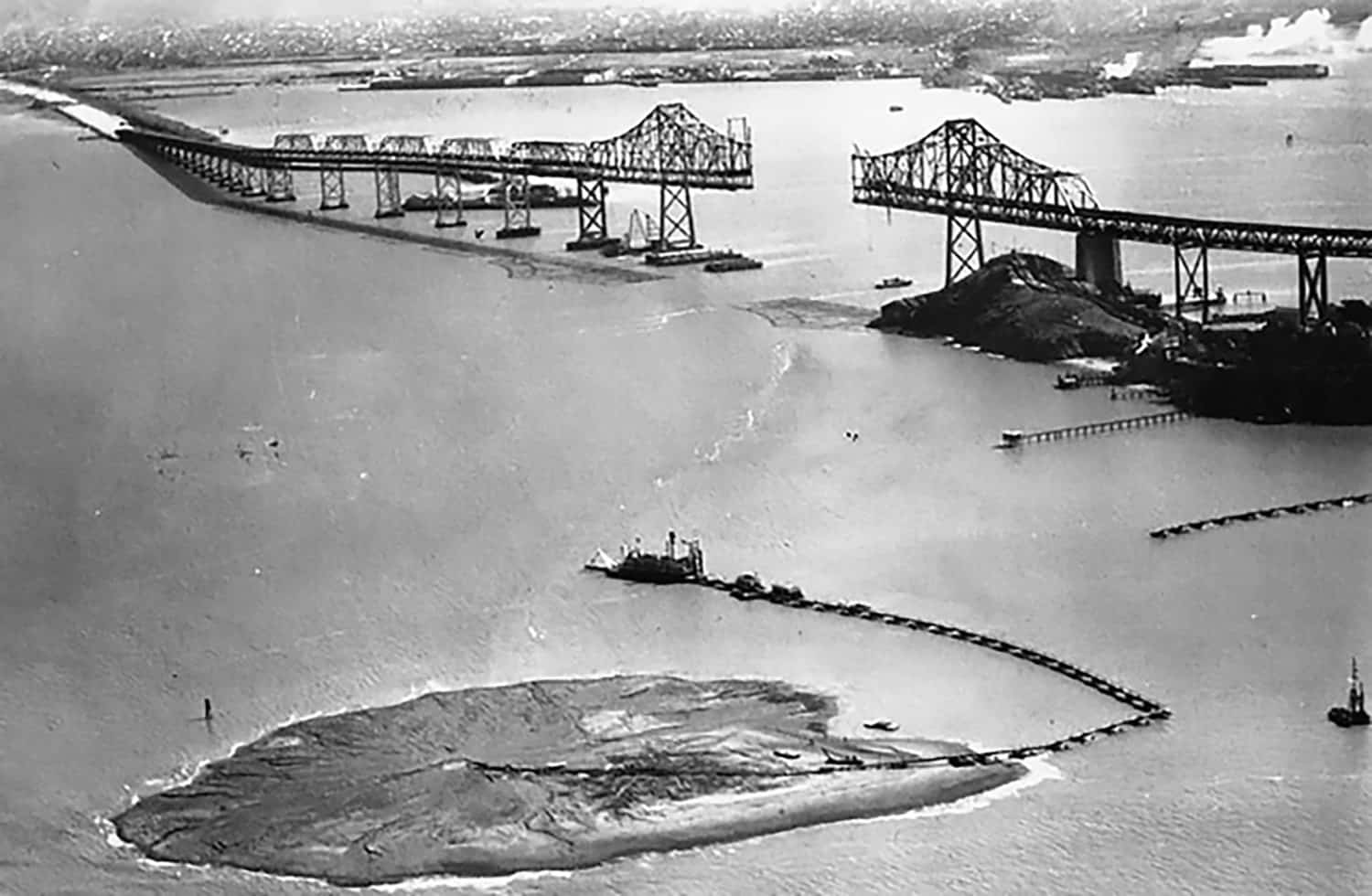 Aerial view of Treasure Island at the beginning of construction along with the Bay Bridge.